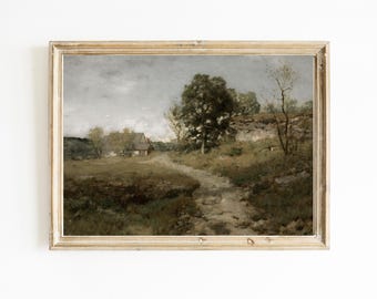 May include: A framed landscape painting depicts a rural scene with a dirt path leading to a small house. The artwork features muted tones of brown, green, and gray, with trees and a cloudy sky. The frame is a light, natural wood color.
