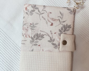 cream-colored goose down padded health record book cover