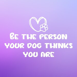 May include: A digital art print with a gradient purple background. The image features a white heart with a paw print inside, and the text "BE THE PERSON YOUR DOG THINKS YOU ARE" in a bold, white font. The design is suitable for pet lovers.