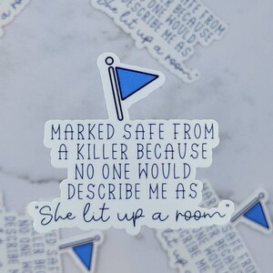 May include: White sticker with blue flag graphic and text that reads "Marked safe from a killer because no one would describe me as "She lit up a room""