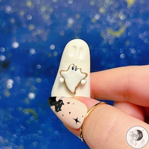 ADOPT A GHOST: Handmade little ghostie holding a tiny ghost cookie