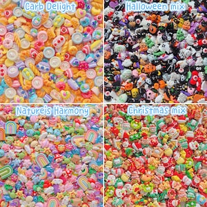 May include: A collection of four distinct sets of small resin cabochons. The top left quadrant labeled Carb Delight features food-themed shapes. The top right labeled Halloween mix shows spooky figures. The bottom left Nature's Harmony displays rainbows and flowers, while the bottom right Christmas mix contains holiday-themed items.
