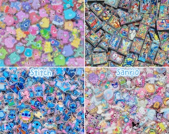 May include: A collection of acrylic charms featuring Care Bears, Disney characters, Stitch, and Sanrio figures. The charms are colorful, flat, and display various cartoon designs, including bears, classic animation characters, and small creatures.