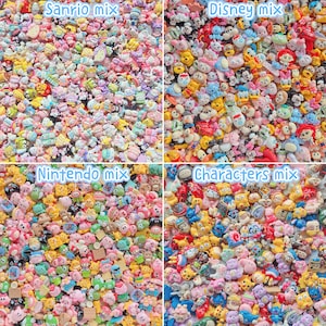 May include: A collection of small, colourful resin cabochons organised into four quadrants labelled Sanrio mix, Disney mix, Nintendo mix, and Characters mix. Each section features a dense assortment of miniature character-themed charms.