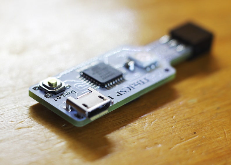 May include: A small circuit board with a micro USB port, a reset button, and the text "FT232R" printed on it.