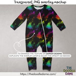 May include: A one-piece baby outfit with a vibrant, colorful cloud-like pattern on a black background. The outfit has long sleeves, a zipper down the front, and the text "Transparent PNG overlay mockup". The website address is https://thedoodledame.com/.