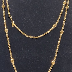 Miriam Haskell faceted gold bead necklace.