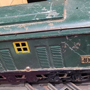 Early American Flyer O gauge train and track with two switches and an X track with parts