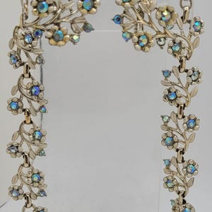 MCM Coro White Enamel and Blue Aurora Borealis Foral Demi-Parure, necklace and earring set