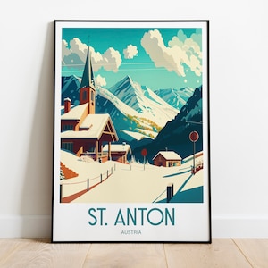 May include: A vintage-style travel poster featuring a snowy mountain village with a church steeple, a red roofed building, and a winding road. The poster is titled "St. Anton, Austria".
