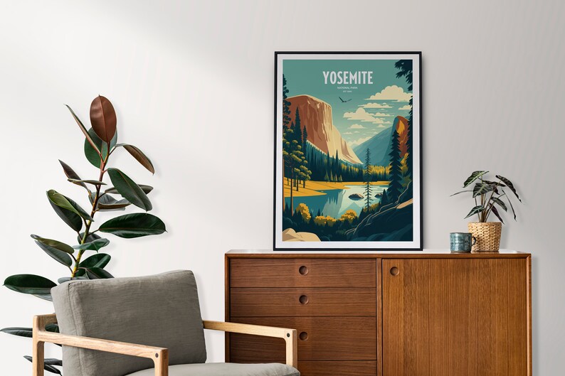 May include: A framed poster with a vintage travel illustration of Yosemite National Park. The poster features a mountain range, a lake, and a forest. The text "Yosemite National Park" is printed in white on a blue background.