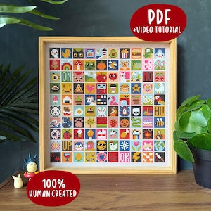 Könnte beinhalten: Ein quadratisches Kreuzstich-Muster in einem hellen Holzrahmen mit einem Raster aus 100 kleinen, bunten Pixel-Art-Symbolen, darunter Tiere, Lebensmittel, Zeichen und Texte wie LOVE, NO, HI, UP, FUCK und OK. Das Design ist als PDF und Video-Tutorial erhältlich.