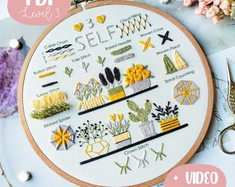 May include: A white embroidery hoop featuring a range of embroidery stitches and designs, including a cable chain, bullion stitch, tulip stitch, raised needle, woven cross, woven picot, spiral couching, crown stitch, and ribbed spider. The hoop is labelled "PDF Level 3" and "SELF" with a heart. The text "+ VIDEO tutorial" is in the bottom right corner.