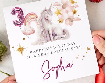 May include: A birthday card with a unicorn illustration, a rainbow, and a number 3 balloon. The card reads "Happy 3rd Birthday to a Very Special Girl" and includes the name "Sophia" in a cursive font.