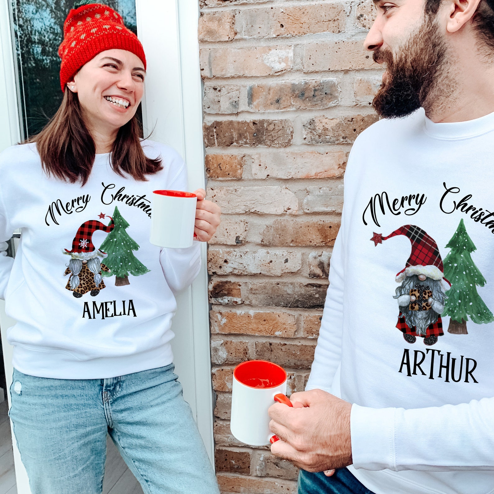Matching Christmas couple outfits wearing coordinating Christmas sweaters