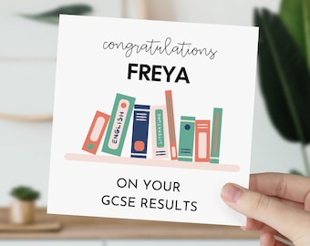 May include: A white card with the text "congratulations FREYA on your GCSE results". The card features a colorful illustration of a bookshelf with books labeled "English" and "Literature".