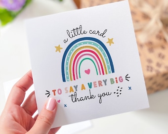 May include: A white card with a rainbow design and the text "a little card to say a very big thank you".