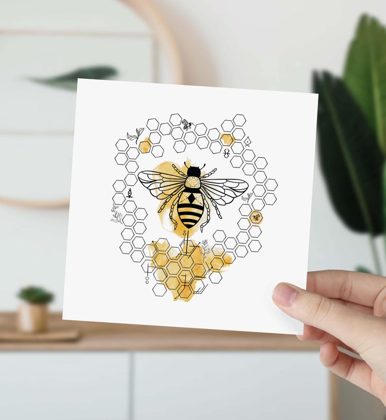May include: A black and white illustration of a bee in a honeycomb pattern with a yellow watercolor wash. The bee is in the center of the honeycomb and has its wings spread out.