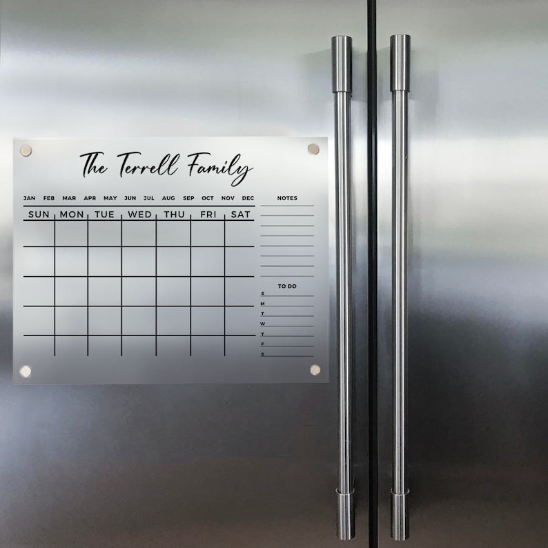 May include: A white dry-erase calendar with the text "The Terrell Family" at the top. The calendar has spaces for each month of the year, days of the week, notes, and a to-do list.