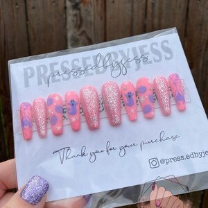 Pink Halloween press on nails.