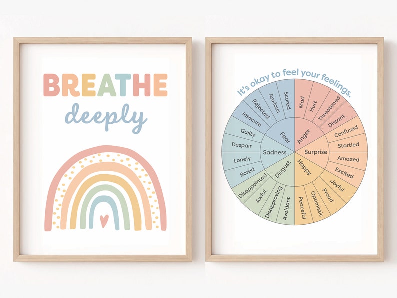 May include: Two framed prints with a pastel rainbow and the words "BREATHE deeply" on the left and a wheel of emotions with the text "It's okay to feel your feelings." on the right.