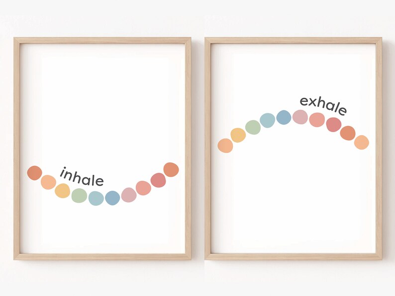 May include: Two framed prints with a rainbow of coloured circles arranged in an arc. The left print says "inhale" and the right print says "exhale".