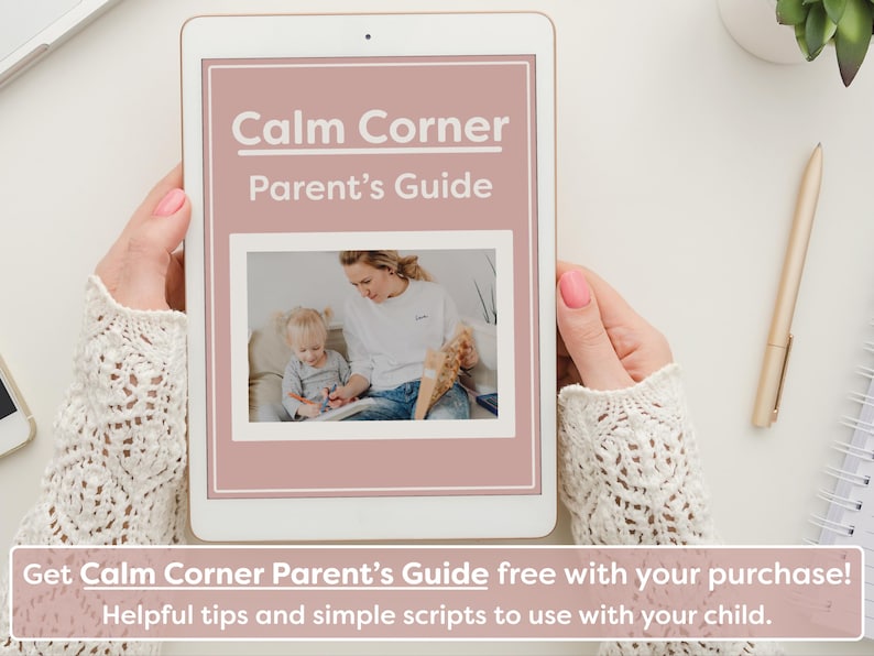 May include: A digital tablet displaying a pink and white document titled "Calm Corner Parent's Guide". The document features a photo of an adult woman and a young child sitting together. The text "Get Calm Corner Parent's Guide free with your purchase! Helpful tips and simple scripts to use with your child." is displayed below the tablet.