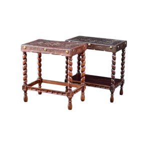 May include: Two antique wooden side tables. The tables have square tops with carved floral designs and brass accents. The legs are intricately carved in a twisted rope design. One table is a lighter brown, the other is a darker brown.
