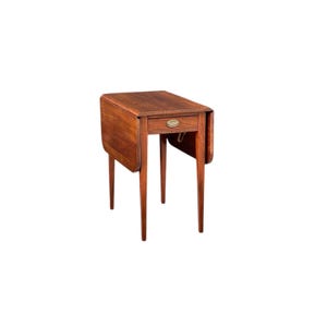 May include: A small, antique wooden drop-leaf table with a single drawer and brass hardware. The table is a warm brown color and has slender, tapered legs. The drop leaves are folded down, and the table is set against a white background.