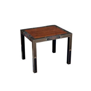 May include: A square side table with a dark wood top and black legs. The table's frame features intricate decorative patterns in gold and dark blue. The table measures approximately 24 inches in length, width, and height.