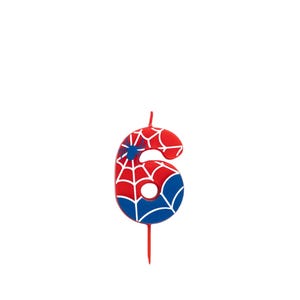 May include: A number 6 candle in red, white, and blue, featuring a spiderweb design. The candle has a blue spider emblem and a red wick. Ideal for a birthday cake.