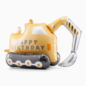 Puede incluir: Globo amarillo con forma de excavadora con la inscripción "HAPPY BIRTHDAY" en gris. El brazo es plateado y la oruga es negra y gris. Ideal para una fiesta de cumpleaños.