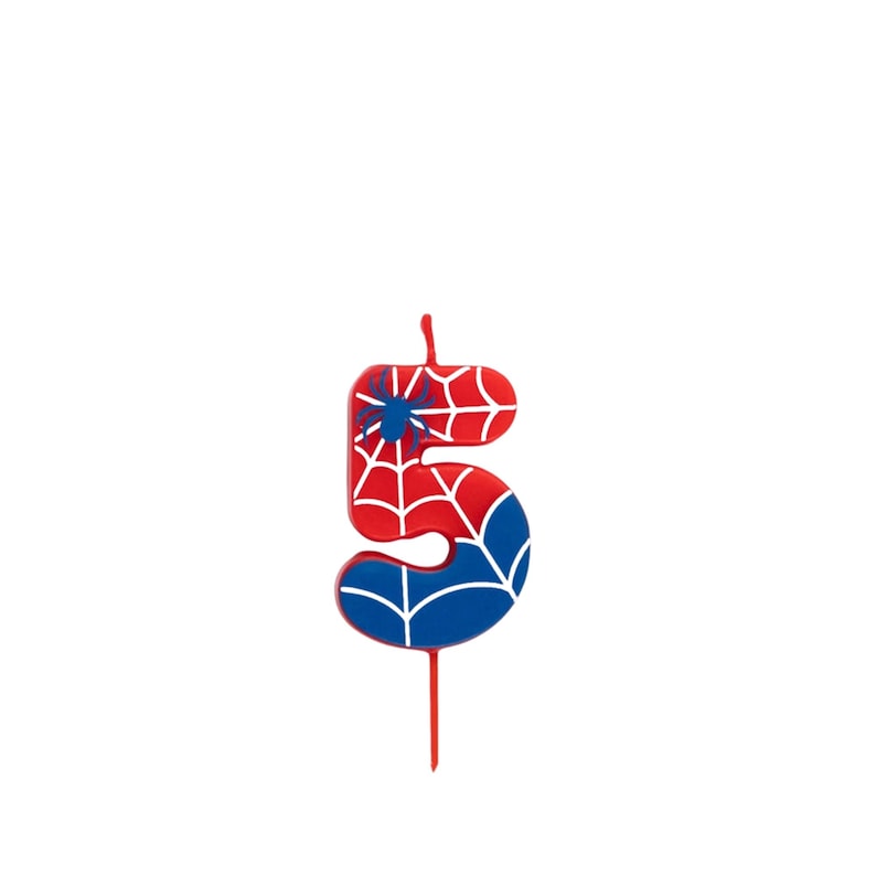 May include: A number 5 birthday candle with a red and blue design. The candle features a spiderweb pattern and a blue spider graphic. The candle is red with white spiderweb lines and blue accents.