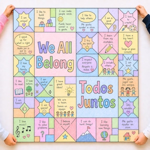 May include: A colorful poster with the words "We All Belong" and "Todos Juntos" in the center. The poster is divided into squares with positive affirmations in English and Spanish, such as "I am kind" and "I like to help others."