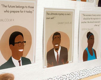 May include: Three inspirational quotes by Malcolm X, Sammy Davis Jr., and Serena Williams are displayed on a noticeboard. Each quote is accompanied by a portrait of the person who said it. The noticeboard is decorated with black and white polka dots.
