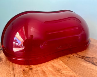 Guzzini breadbasket for space age decoration, light plastic tray. Retro Charm: Vintage Apartment Decor to Transform Your Space