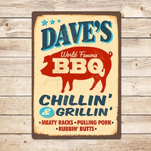 May include: A distressed metal sign with a retro design. The sign displays the words "DAVE'S BBQ" in blue and white, with a red pig illustration. It also includes "CHILLIN' & GRILLIN'" and a list of BBQ menu items.