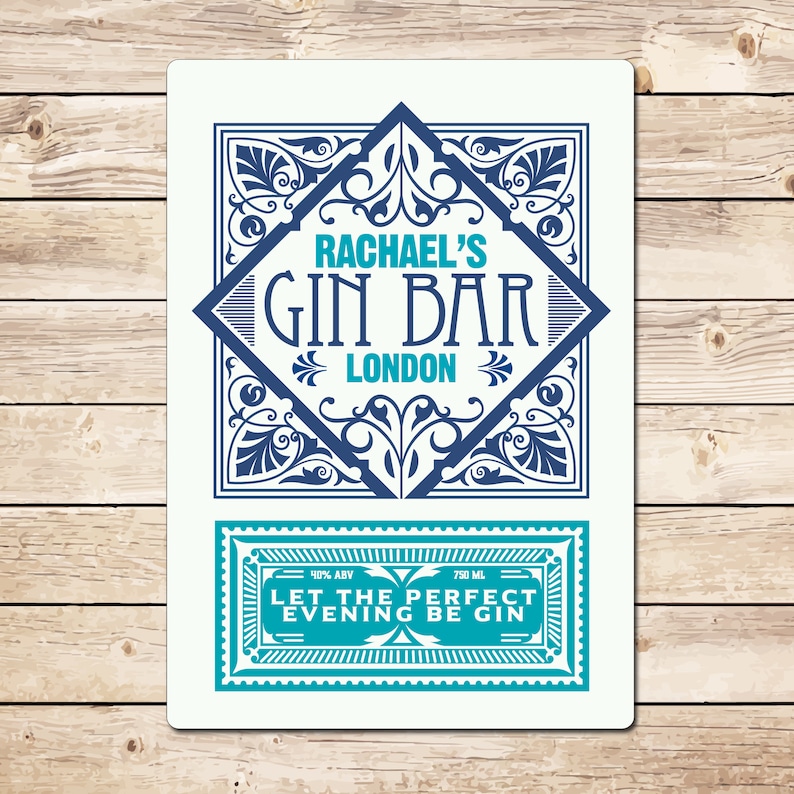 May include: A blue and white vintage-style label with the text "Rachael's Gin Bar London" and a smaller label below that says "40% ABV 750 ML Let the perfect evening be gin".