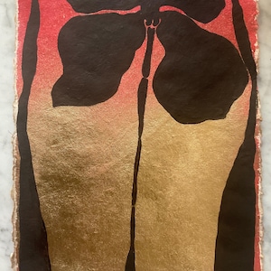 May include: A rectangular piece of textured paper featuring a hand-painted design. The background transitions from a vibrant red at the top to a metallic gold at the bottom. A large, dark brown abstract floral shape is centered at the top.