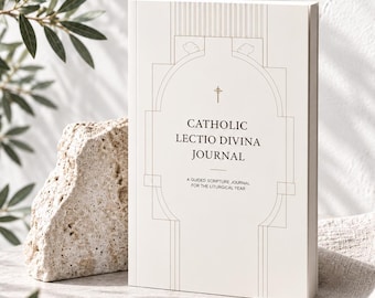 May include: A white journal with a thin gold line illustration of an archway and a small cross. The text reads CATHOLIC LECTIO DIVINA JOURNAL and A GUIDED SCRIPTURE JOURNAL FOR THE LITURGICAL YEAR in black serif font on the front cover.