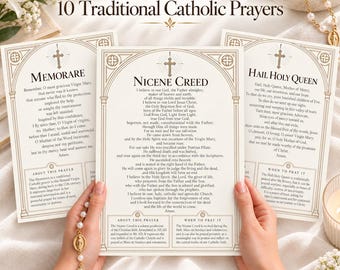 May include: A 10-page bundle of traditional Catholic prayers printed on cream-colored paper with gold-toned decorative borders and cross icons. The pages feature the Nicene Creed, Memorare, and Hail Holy Queen with descriptive text.