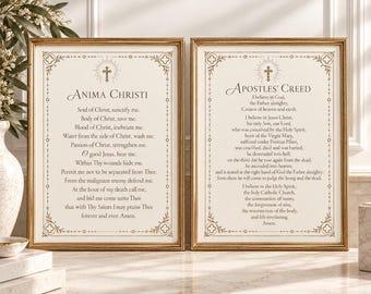 May include: Two rectangular framed prints featuring religious text on off-white paper. The left print displays the Anima Christi prayer, and the right print displays the Apostles' Creed. Both have gold frames and decorative borders with a cross icon.
