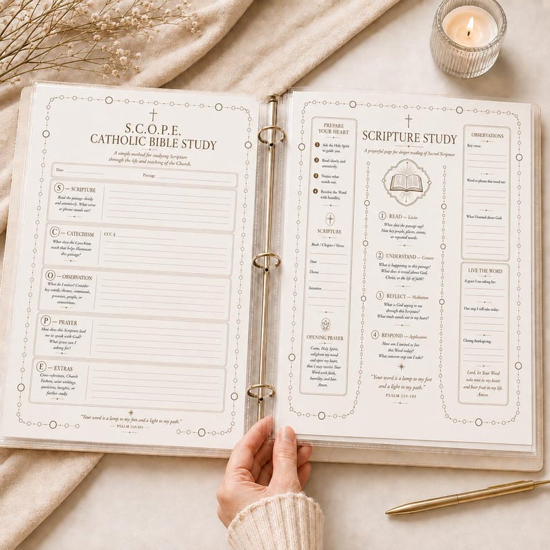 May include: An open three-ring binder featuring printed S.C.O.P.E. Catholic Bible Study and Scripture Study worksheets on white paper. The pages include structured sections for scripture, catechism, observation, prayer, and reflection.