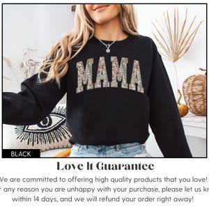 May include: Black sweatshirt with the word "MAMA" in a floral design across the chest. The sweatshirt is black and has long sleeves. The word "BLACK" is in a black rectangle in the bottom left corner.