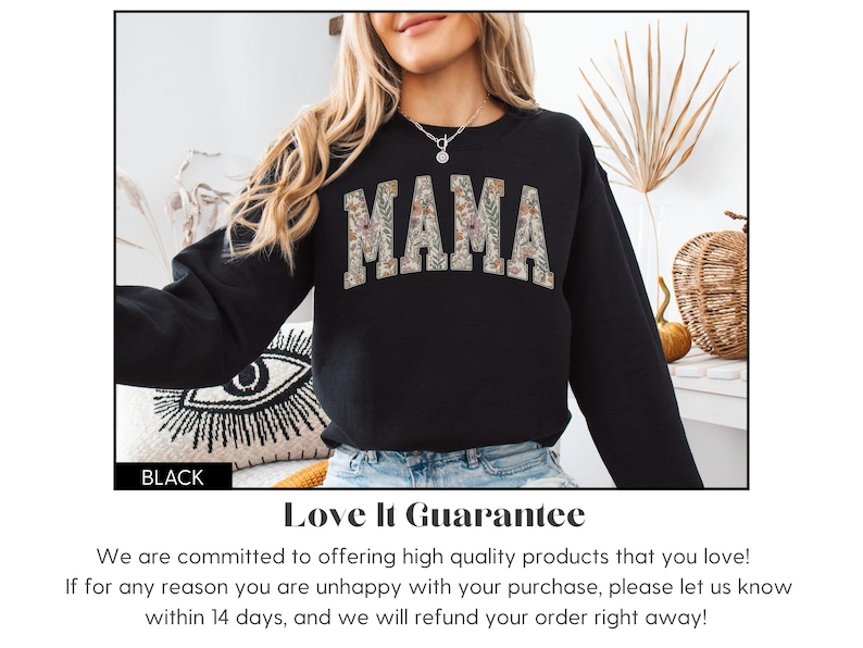 May include: Black sweatshirt with the word "MAMA" in a floral design across the chest. The sweatshirt is black and has long sleeves. The word "BLACK" is in a black rectangle in the bottom left corner.