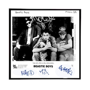 May include: Black and white photo of three men, the Beastie Boys, from left to right: Mike D, MCA, and King Ad-Rock. The photo is from the album "Paul's Boutique".