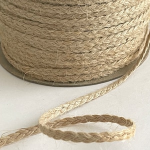 Premium Photo  Natural jute twine roll on white wooden