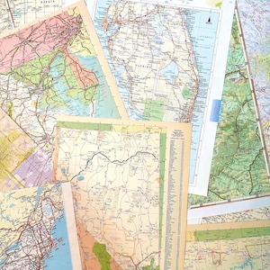 May include: A collection of vintage road maps, overlapping and layered. The maps feature detailed road networks, cities, and geographical features, with a variety of colors and styles. The maps are from different states and regions.