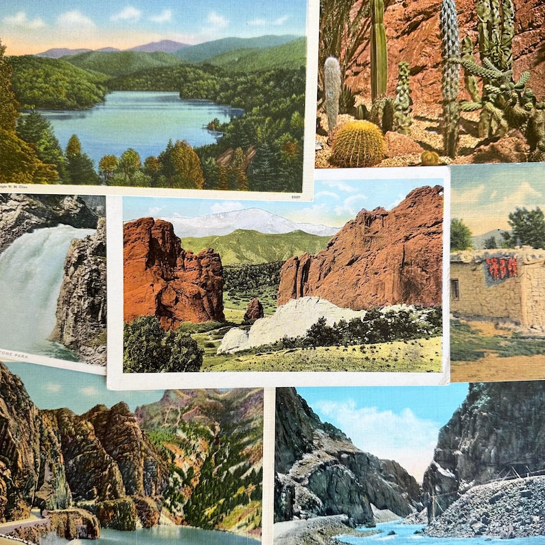 May include: A collection of vintage postcards featuring scenic landscapes. The postcards depict a lake surrounded by trees, a waterfall cascading down a rocky cliff, a red rock formation, a canyon with a river running through it, and a desert scene with a cactus.