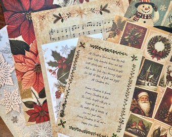 May include: A collection of decorative Christmas-themed paper sheets featuring various designs including red poinsettias, a snowman, musical notes, holly, and a central sheet with printed holiday poetry surrounded by a green leaf border.